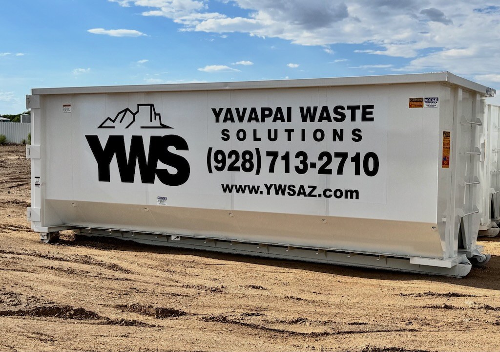 Branded YWS roll-off dumpster from Yavapai Waste Solutions